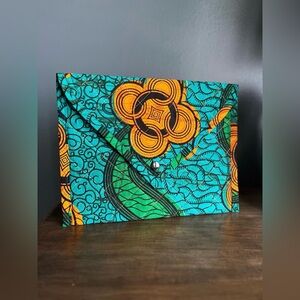 Quilted envelope clutch, handcrafted from secondhand wax print fabric